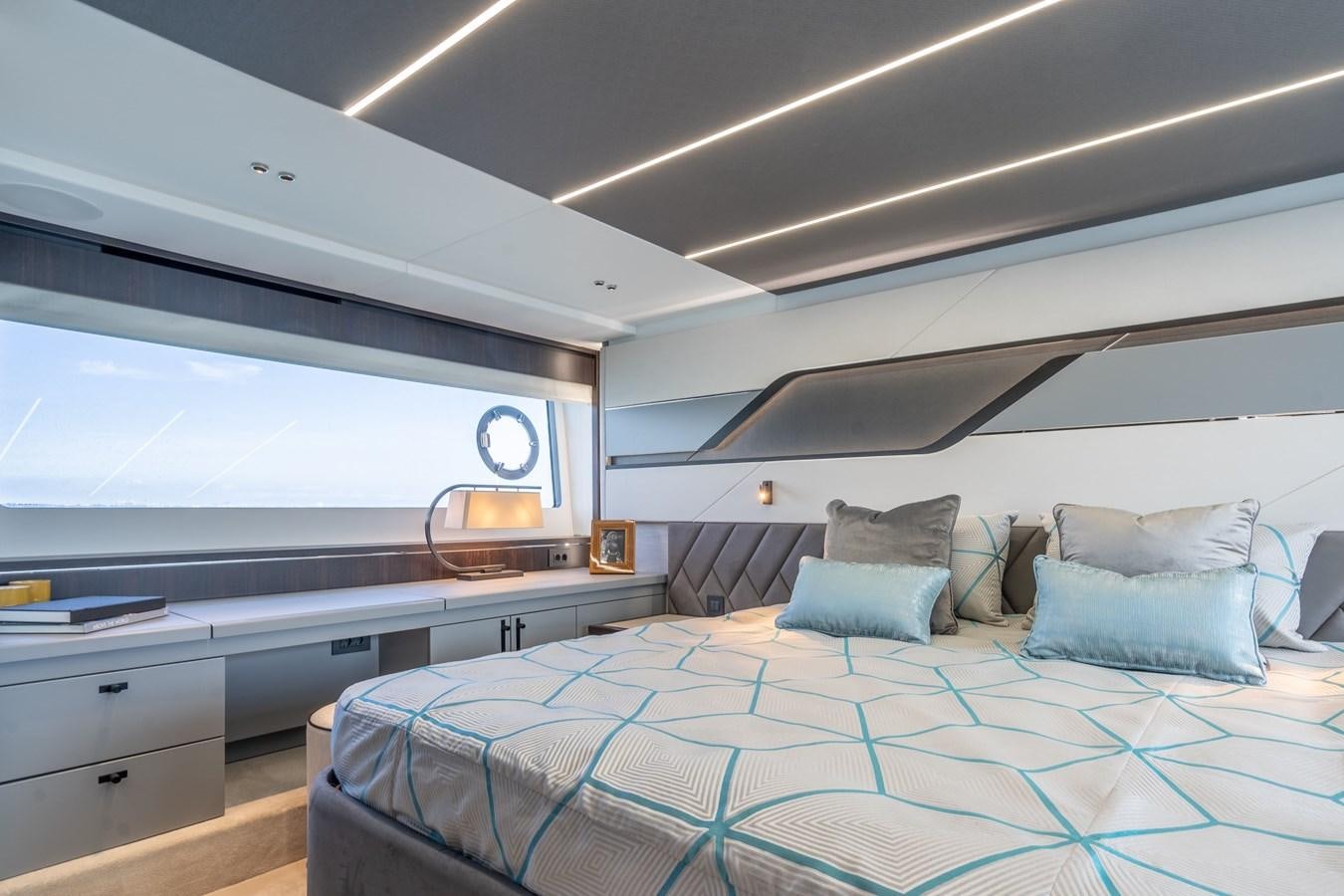 a room with a bed and a window aboard 75 SPORT YACHT Yacht for Sale