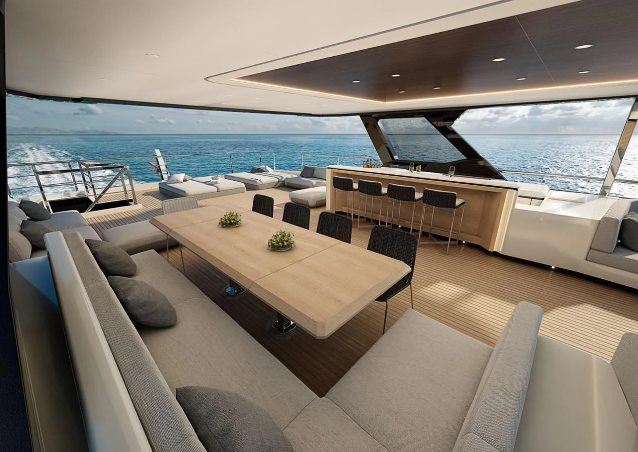 a room with a couch and a table and chairs aboard COLUMBUS CROSSOVER 42/01 Yacht for Sale