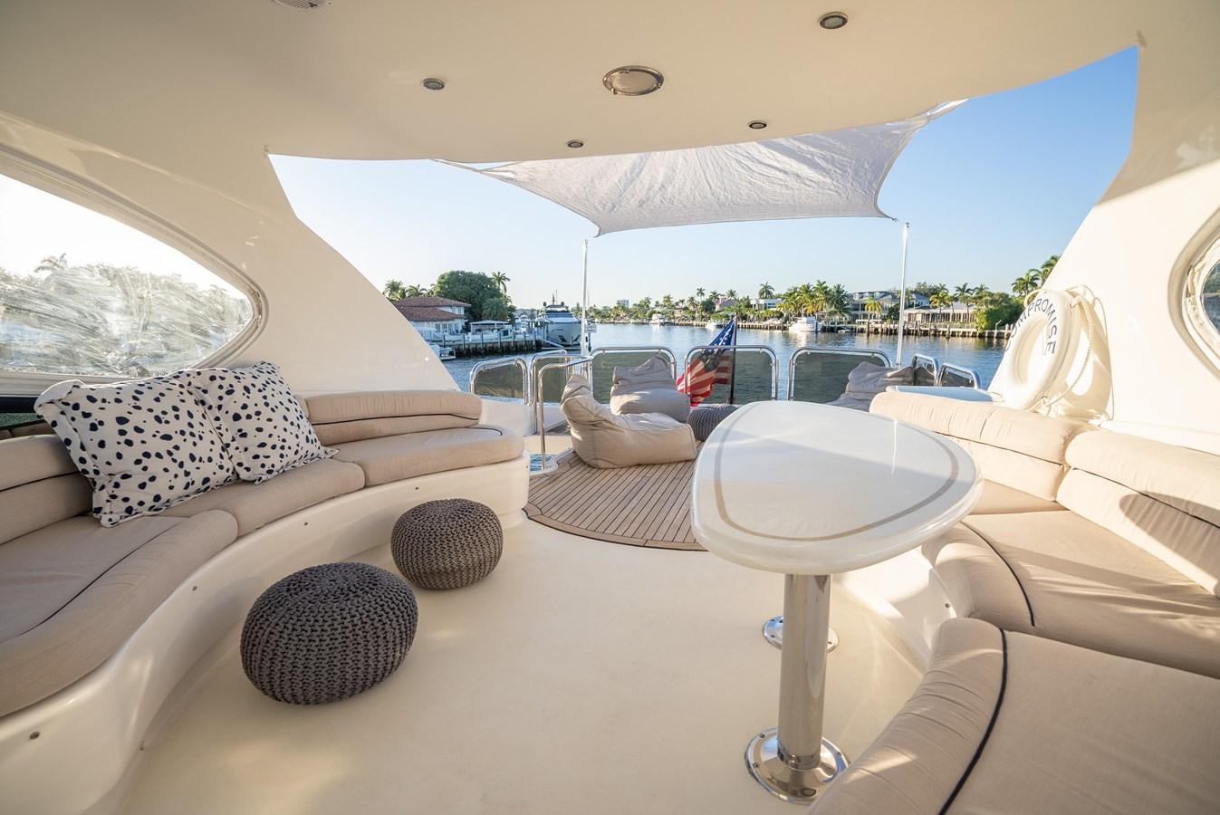 a room with a couch and a table with a table and chairs aboard EDITA  Yacht for Sale