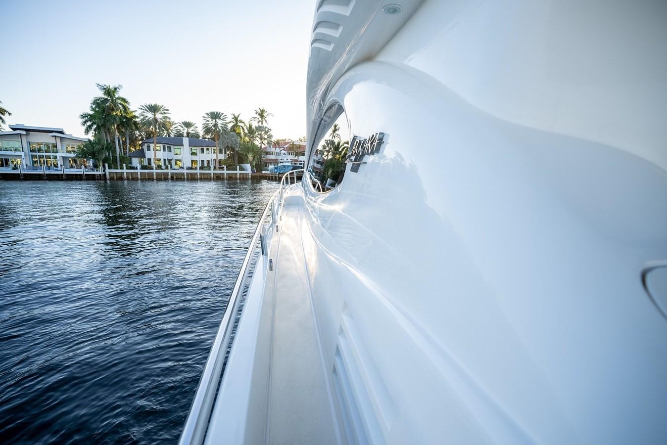 a white boat on the water aboard EDITA  Yacht for Sale