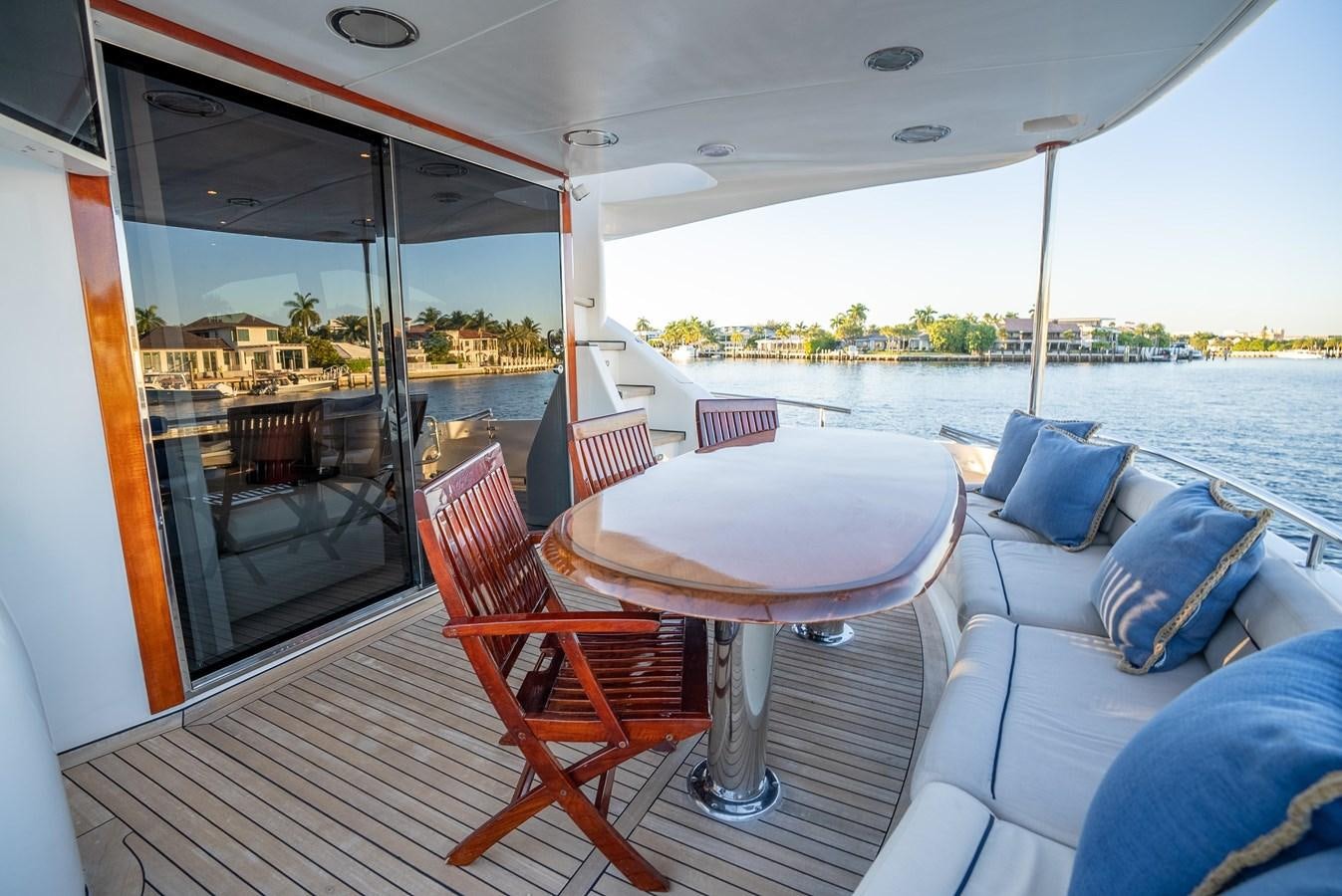 a boat with a table and chairs aboard EDITA  Yacht for Sale