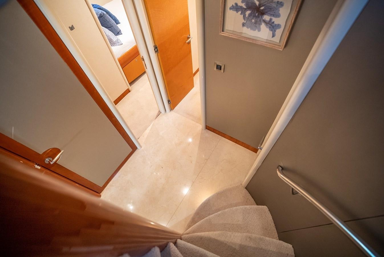 a hallway with a door and a rug aboard EDITA  Yacht for Sale