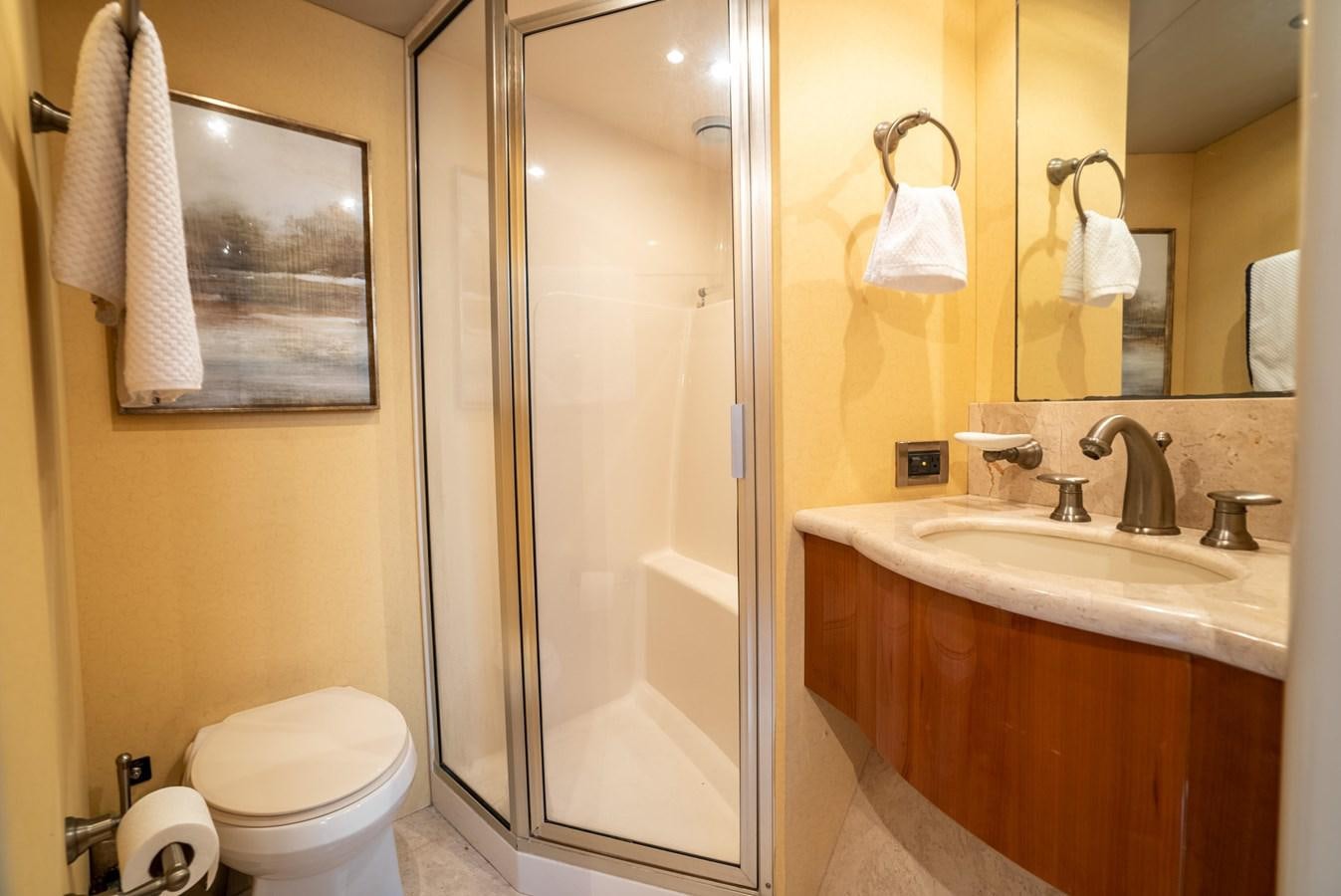 a bathroom with a glass shower door aboard EDITA  Yacht for Sale