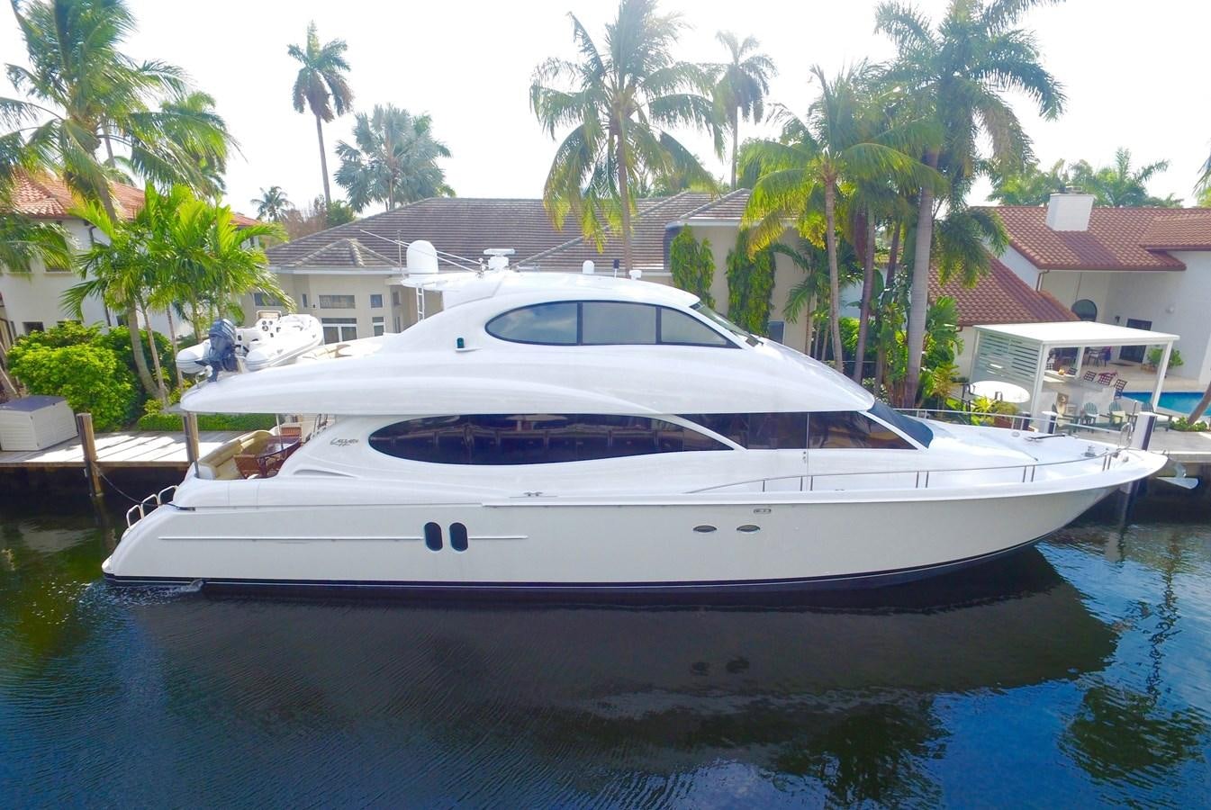 a white yacht docked at a dock aboard ARENITA Yacht for Sale