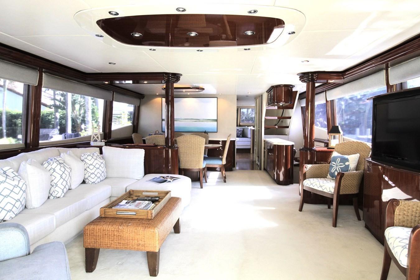 a living room with a large sofa and a tv aboard ARENITA Yacht for Sale