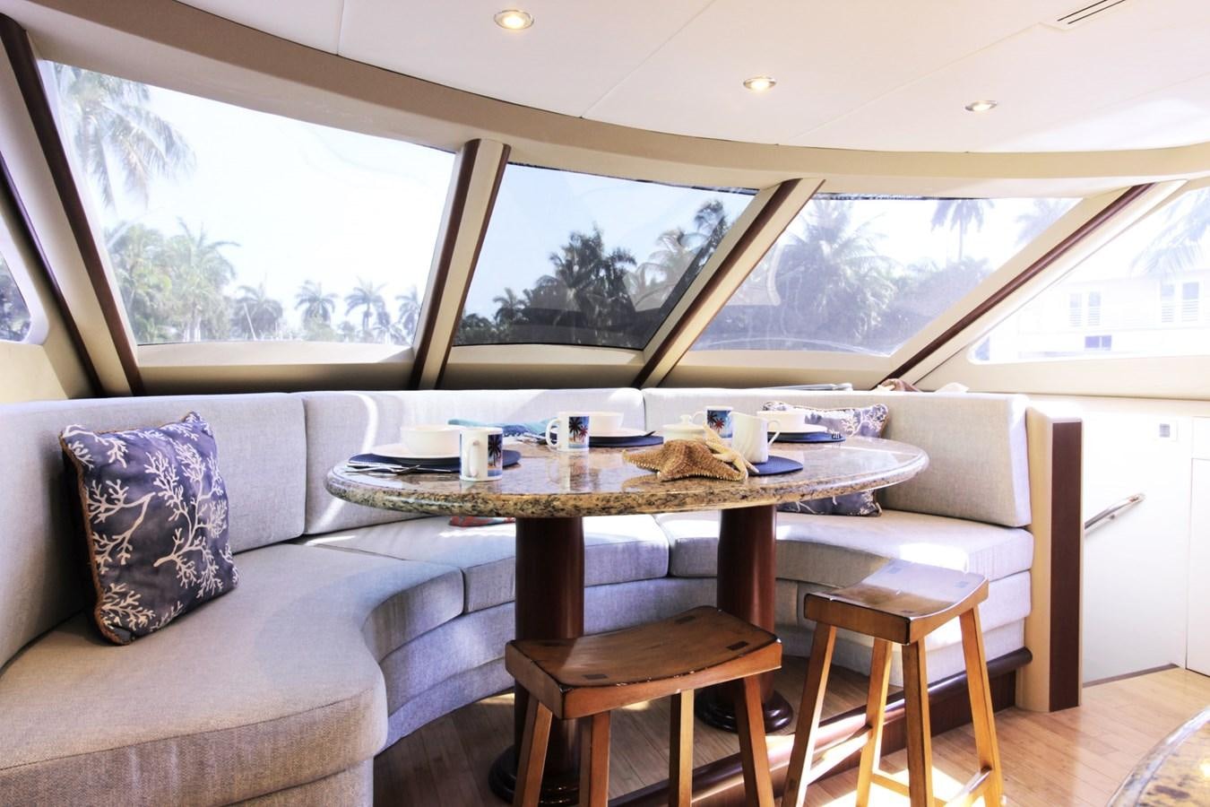 a table and chairs in a room aboard ARENITA Yacht for Sale