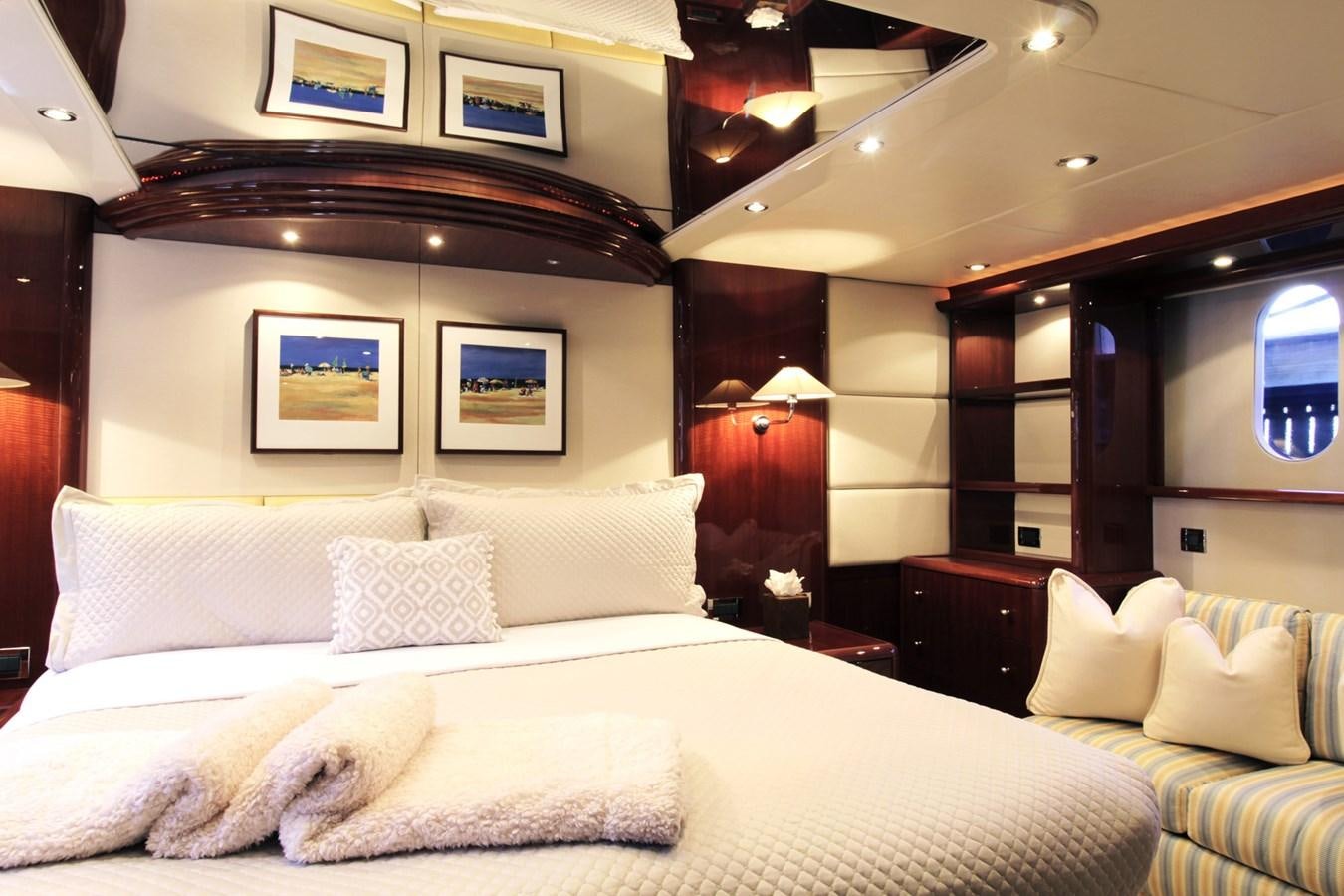 a large bed with white pillows aboard ARENITA Yacht for Sale