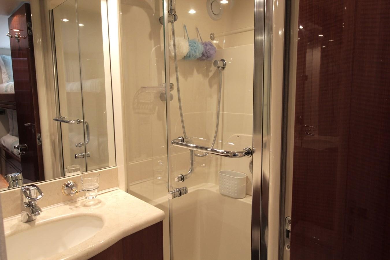 a bathroom with a glass shower aboard ARENITA Yacht for Sale