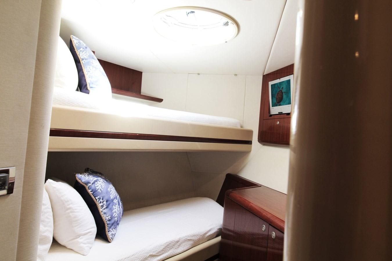 a bed with a white bed and a white wall aboard ARENITA Yacht for Sale