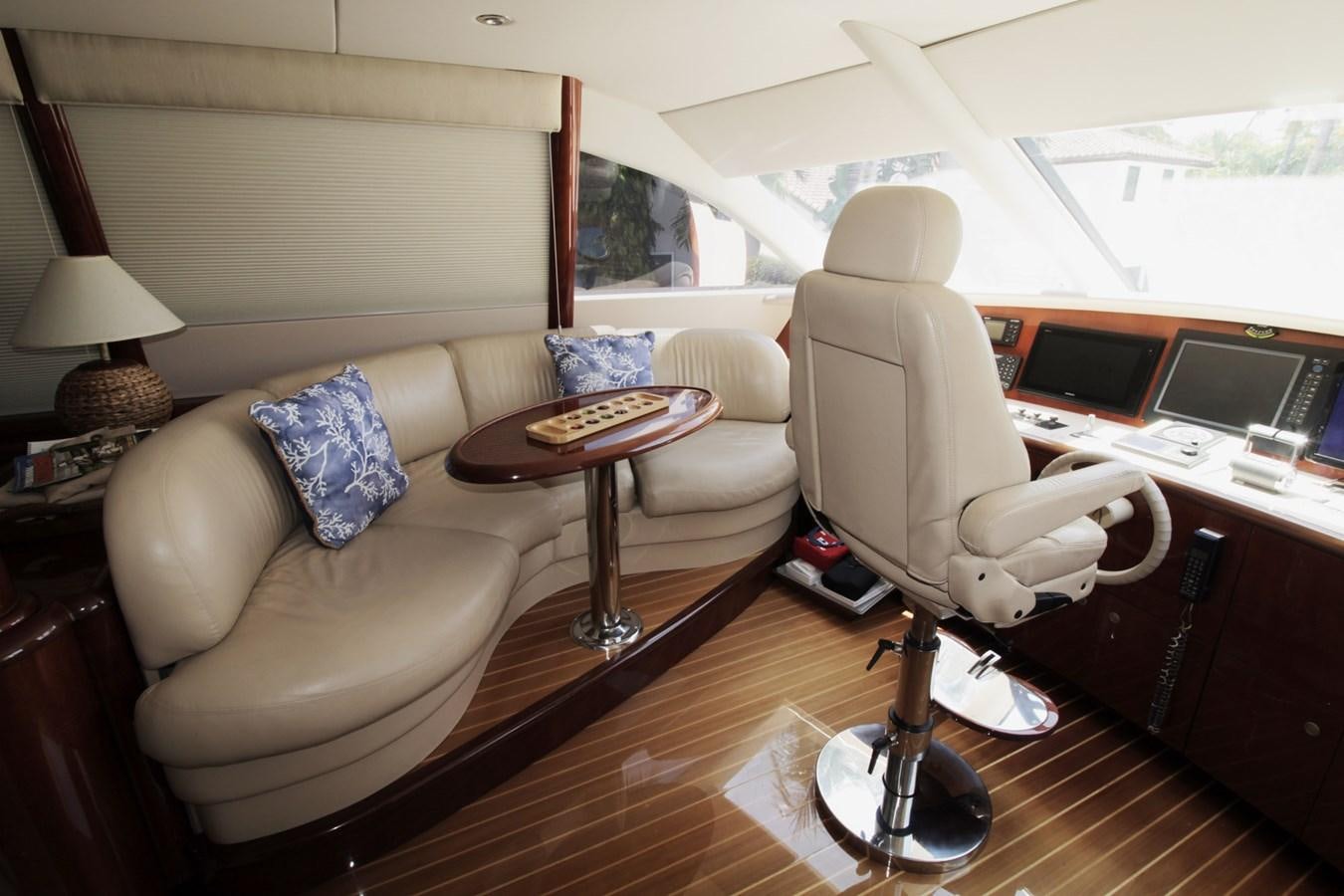 a living room with a couch and a table aboard ARENITA Yacht for Sale