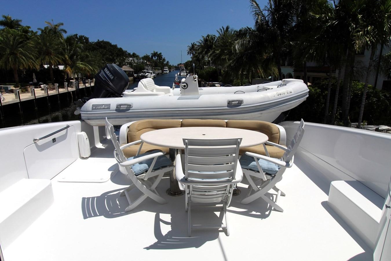 a white boat on a deck aboard ARENITA Yacht for Sale