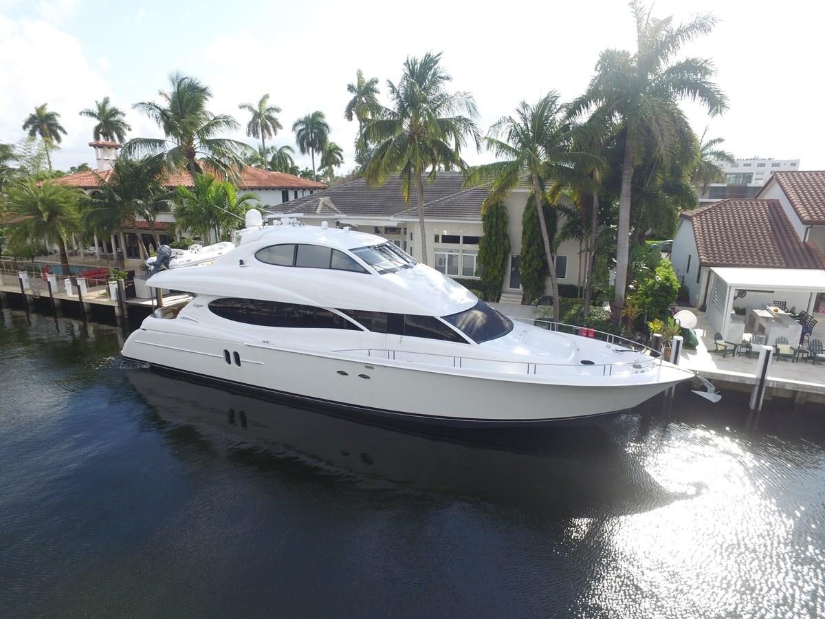 a white yacht docked at a pier aboard ARENITA Yacht for Sale