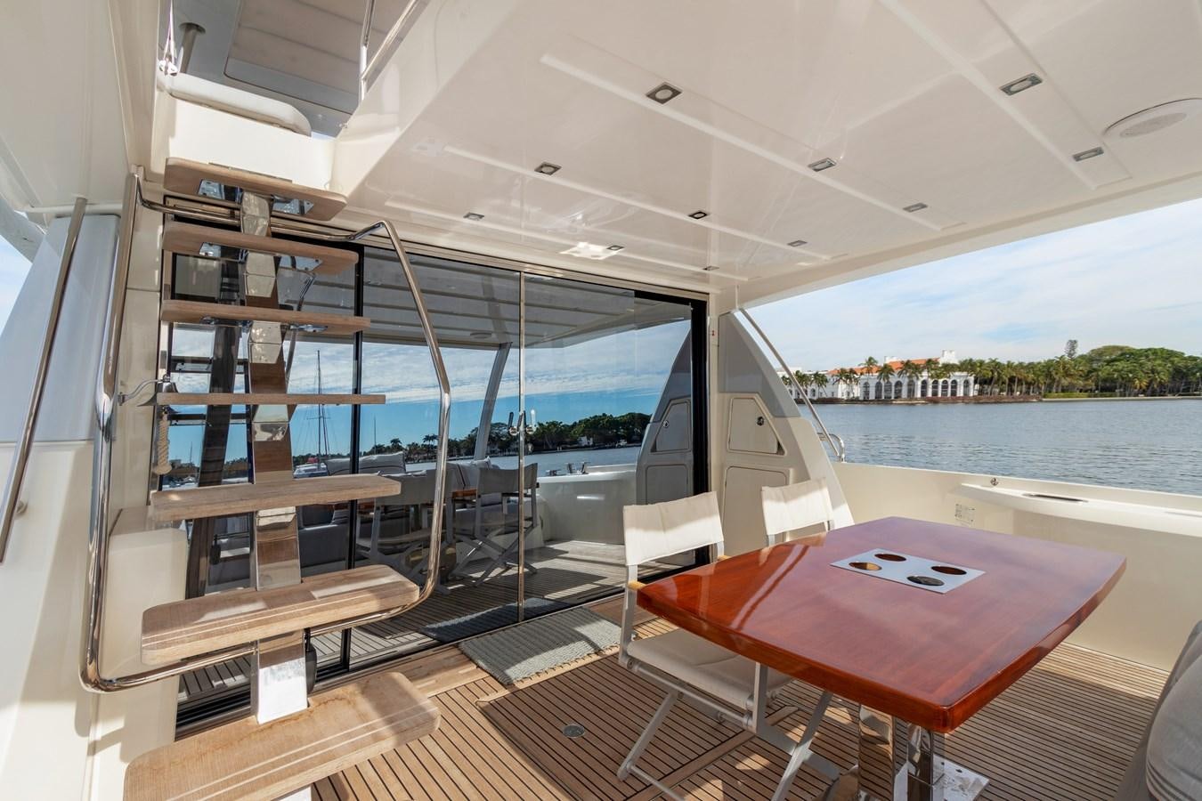 a room with a table and a window aboard JUIL OF THE SEA Yacht for Sale
