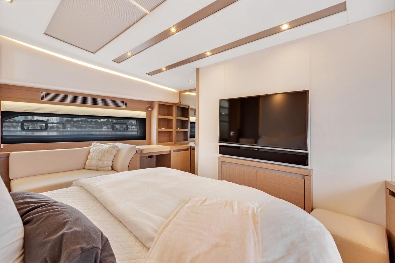 a bedroom with a bed and a television aboard JUIL OF THE SEA Yacht for Sale