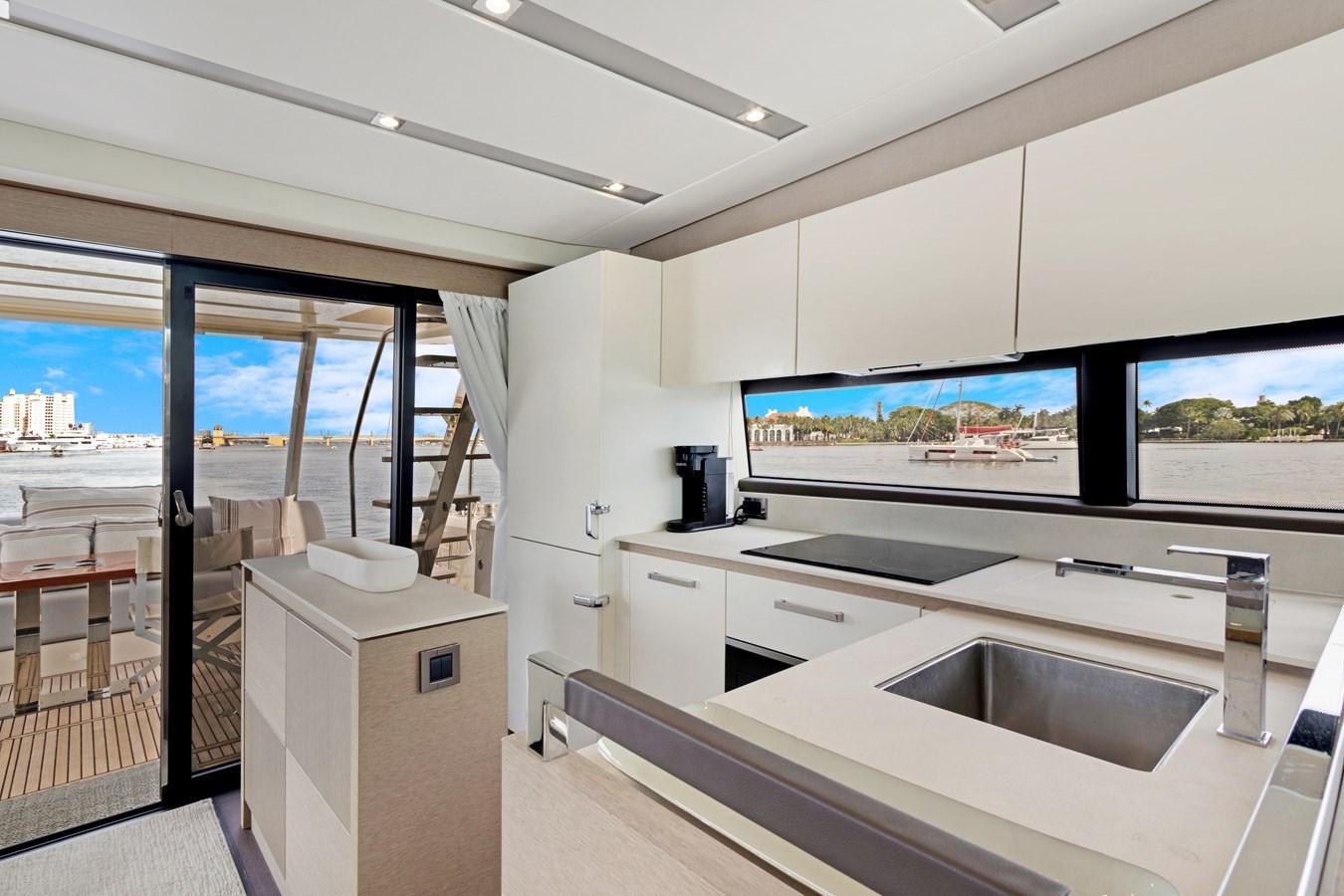 a kitchen with a large tv aboard JUIL OF THE SEA Yacht for Sale