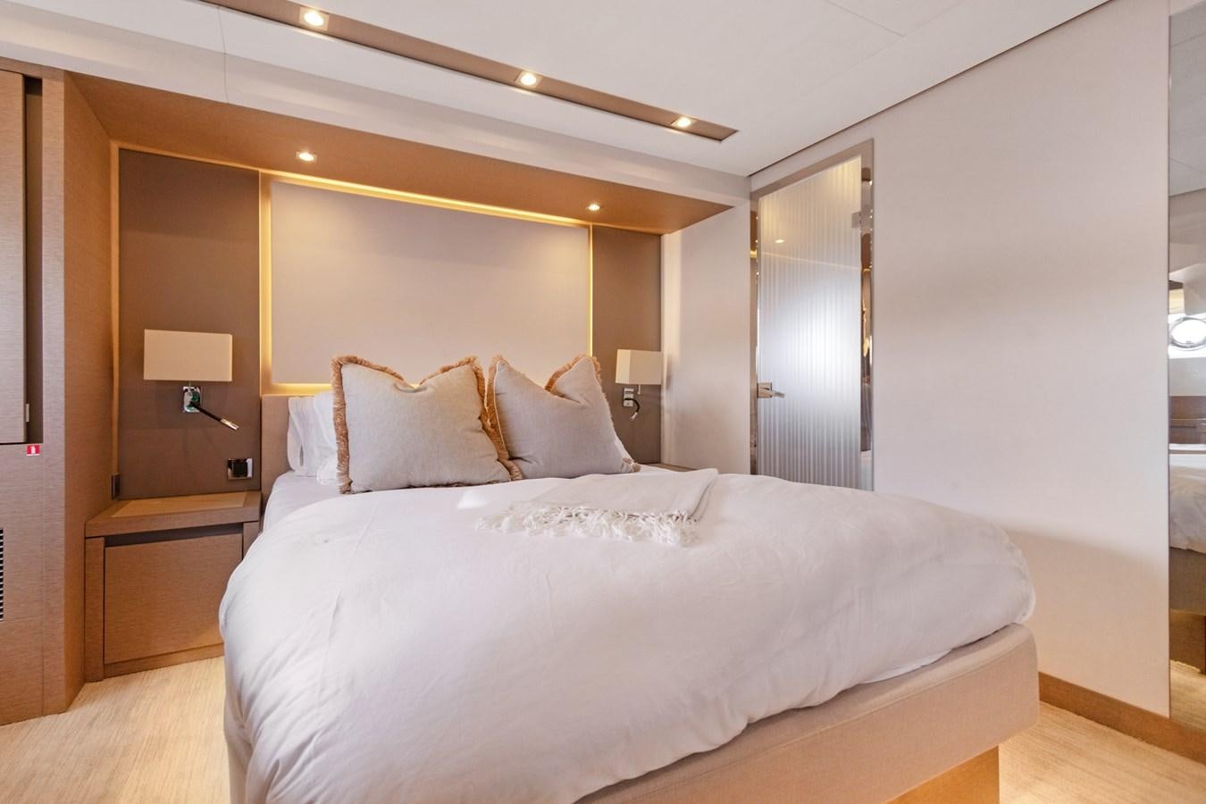 a large bed in a hotel room aboard JUIL OF THE SEA Yacht for Sale