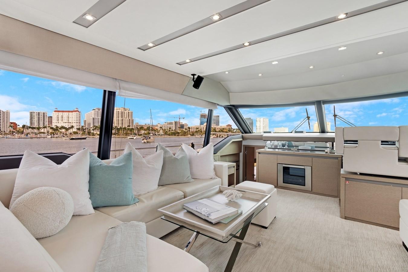 a room with a bed and a table and a window aboard JUIL OF THE SEA Yacht for Sale