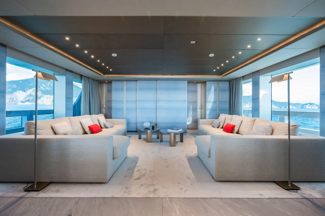 a living room with a couch and a large window aboard SILVER STAR I Yacht for Sale