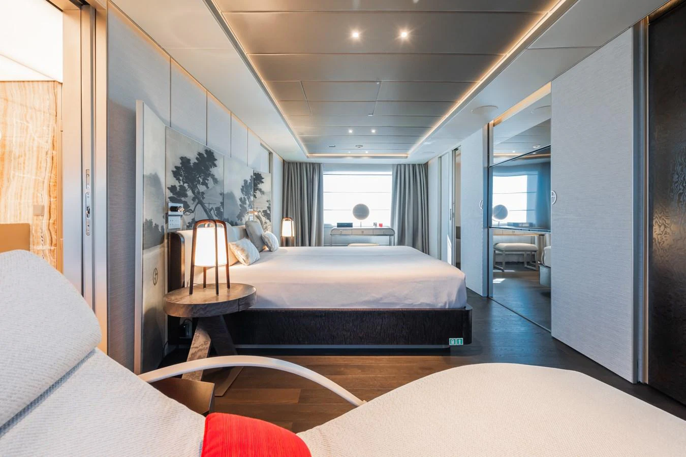 a room with a bed and a desk aboard SILVER STAR I Yacht for Sale
