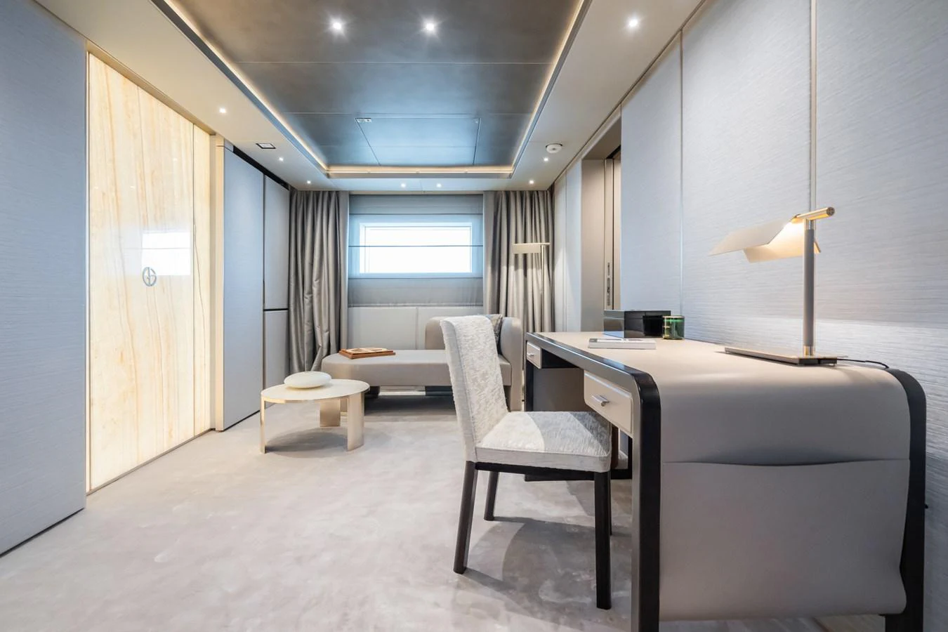 a room with a bed and a desk aboard SILVER STAR I Yacht for Sale