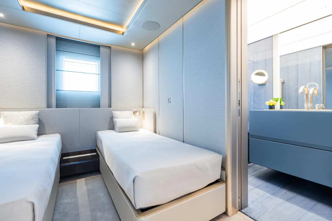 a room with a bed and a mirror aboard SILVER STAR I Yacht for Sale