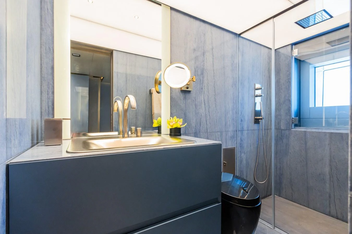a bathroom with a sink and a mirror aboard SILVER STAR I Yacht for Sale