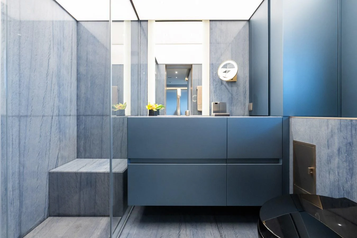 a bathroom with a blue wall aboard SILVER STAR I Yacht for Sale