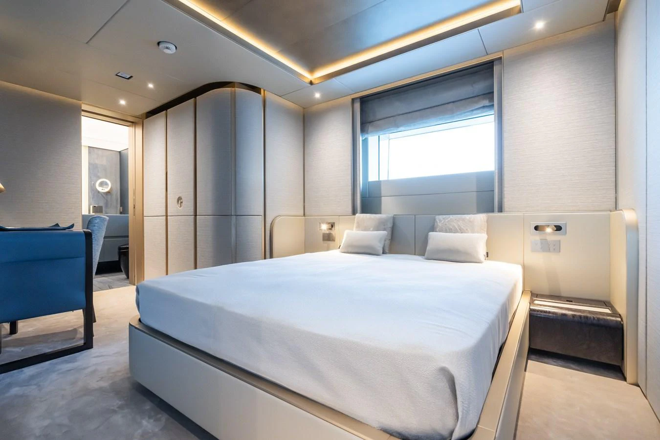 a room with a bed and a chair aboard SILVER STAR I Yacht for Sale