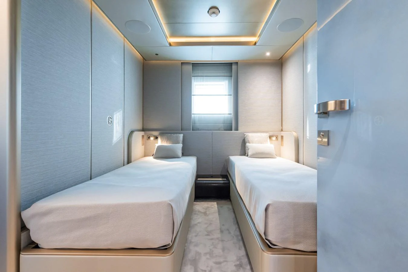 a room with a couple of beds aboard SILVER STAR I Yacht for Sale