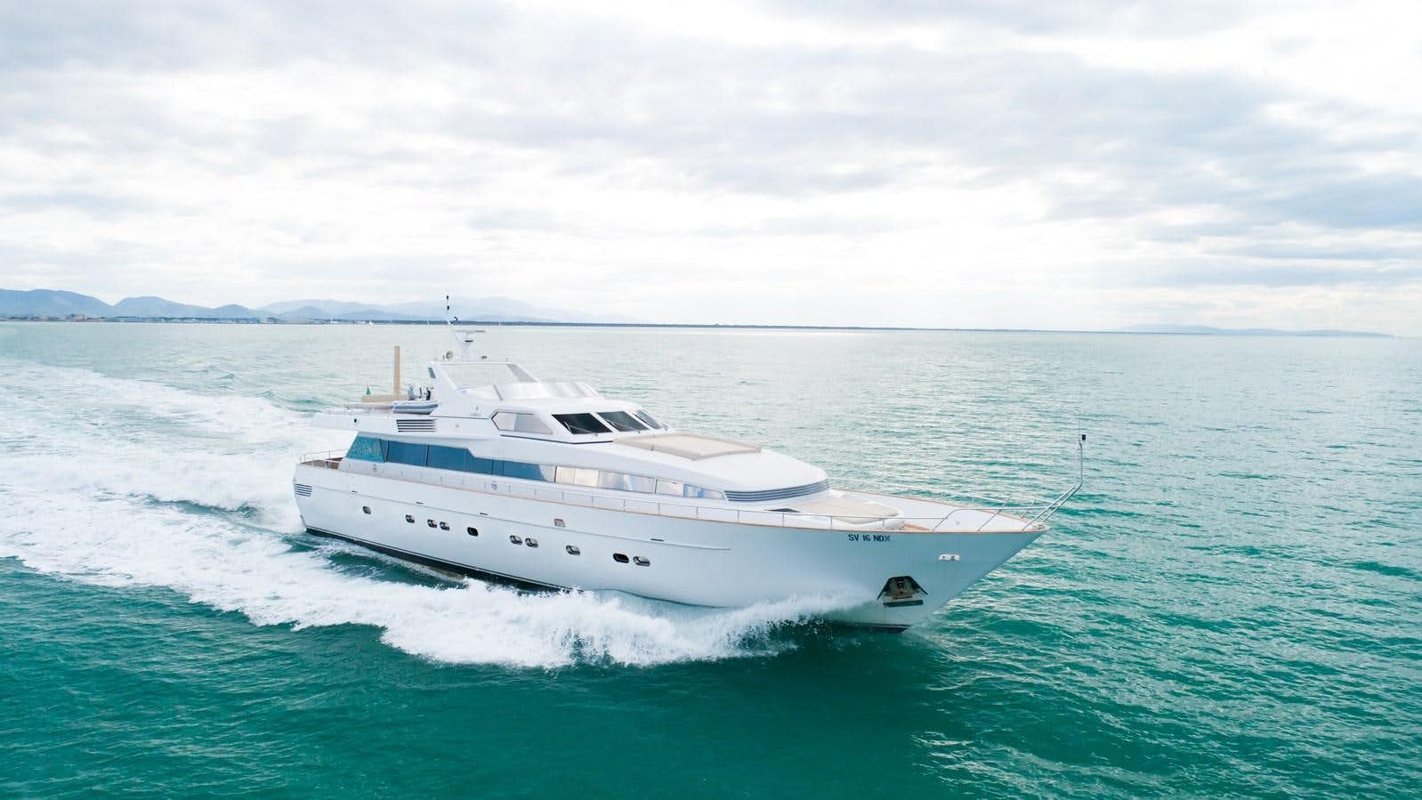 a white yacht in the ocean aboard BABY BOSS Yacht for Sale