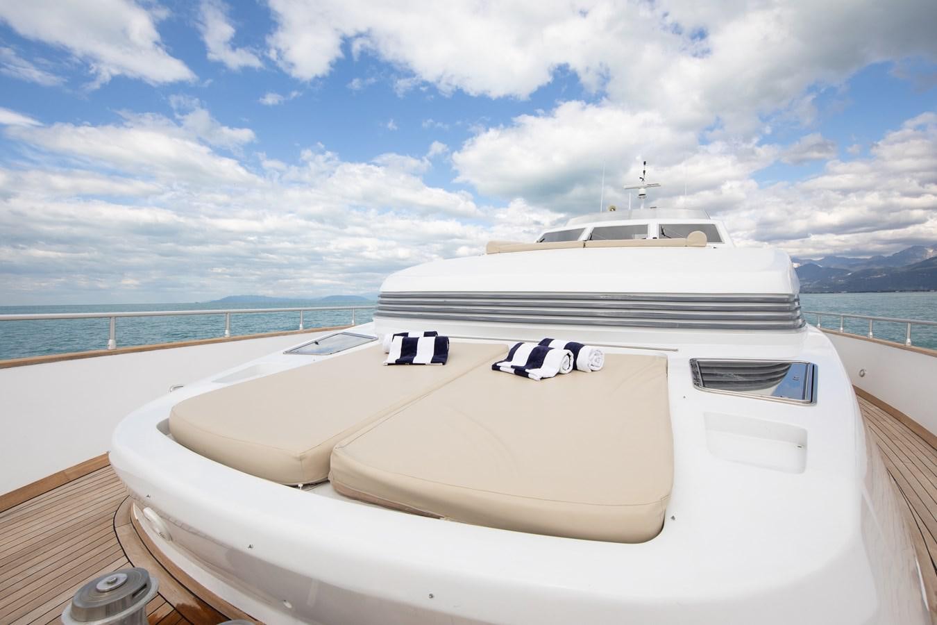 a white boat on a deck aboard BABY BOSS Yacht for Sale