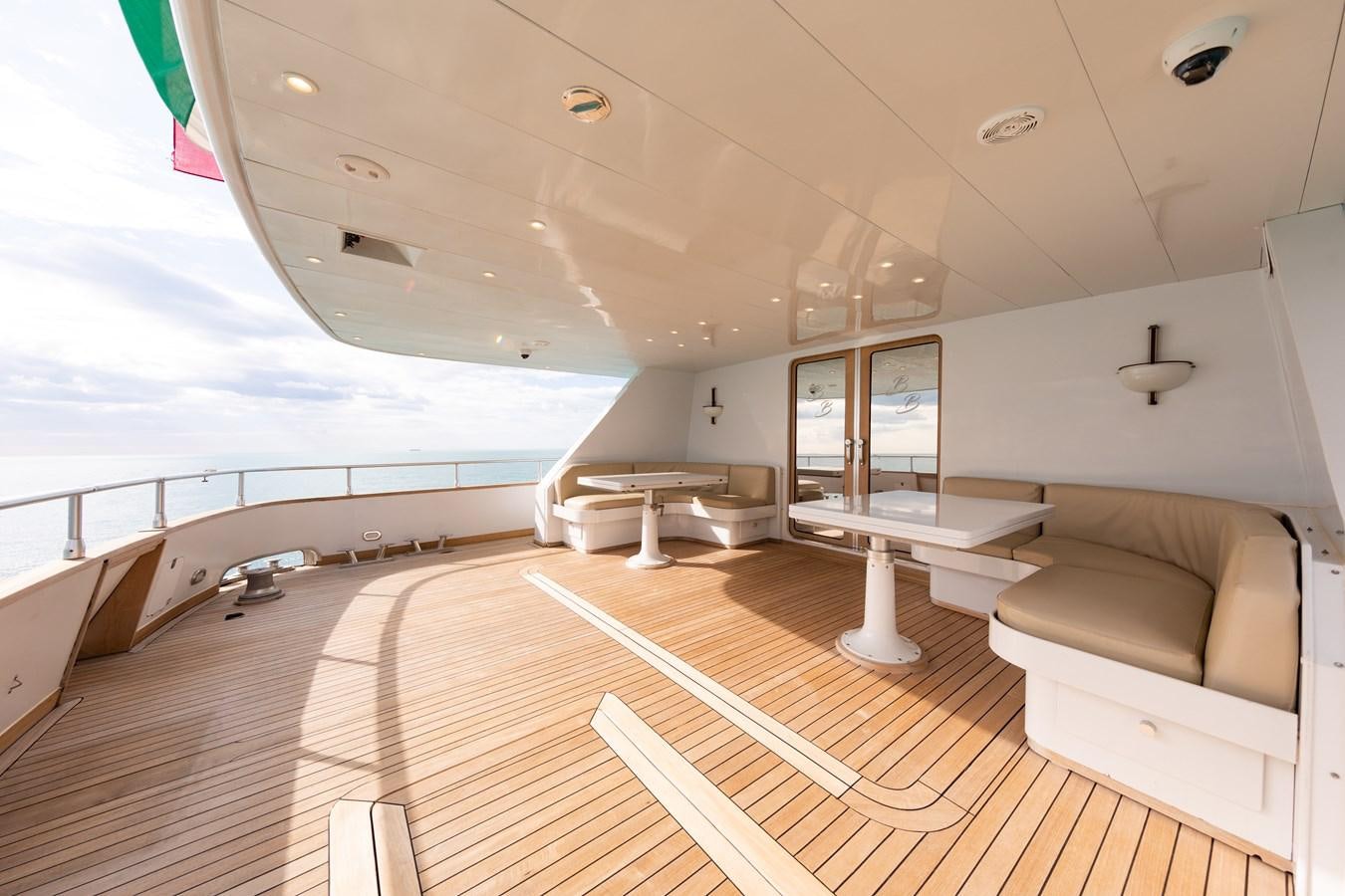a large room with a wood floor and a large window aboard BABY BOSS Yacht for Sale