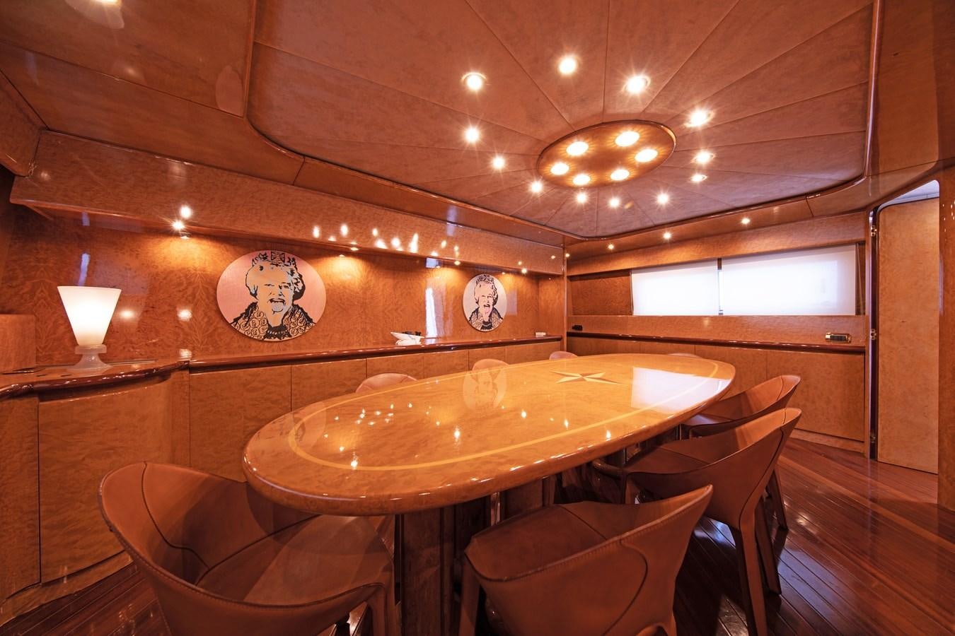 a room with a table and chairs aboard BABY BOSS Yacht for Sale