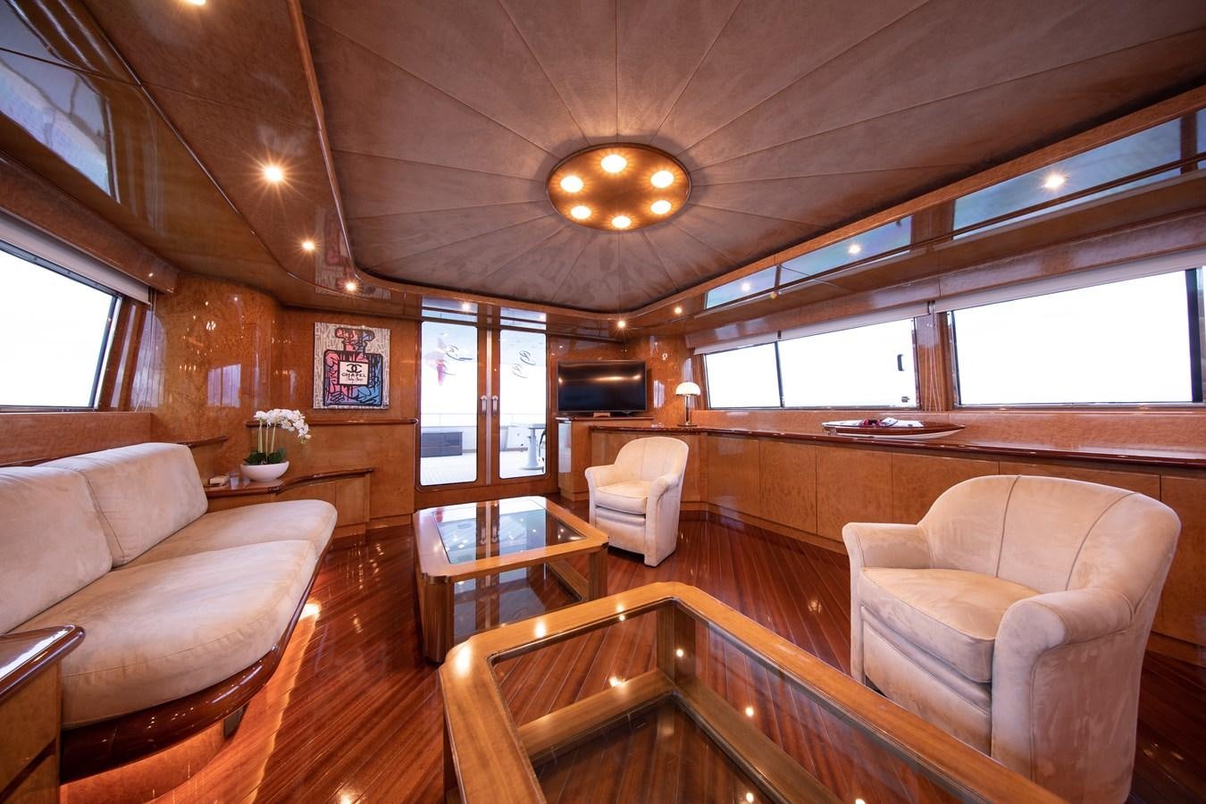 a room with a couch and a table and chairs aboard BABY BOSS Yacht for Sale