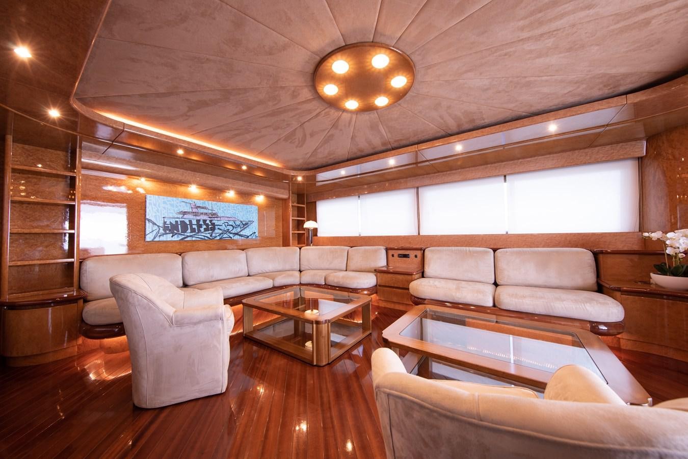 a living room with a wood floor aboard BABY BOSS Yacht for Sale