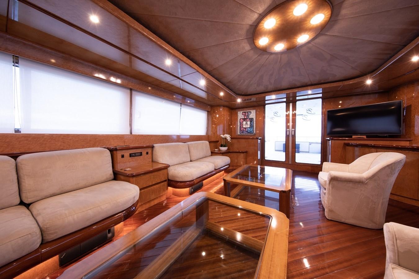 a living room with a wood floor aboard BABY BOSS Yacht for Sale
