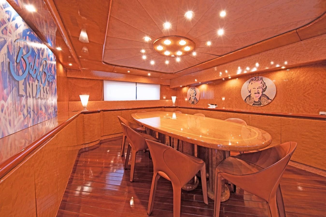 a room with a table and chairs aboard BABY BOSS Yacht for Sale
