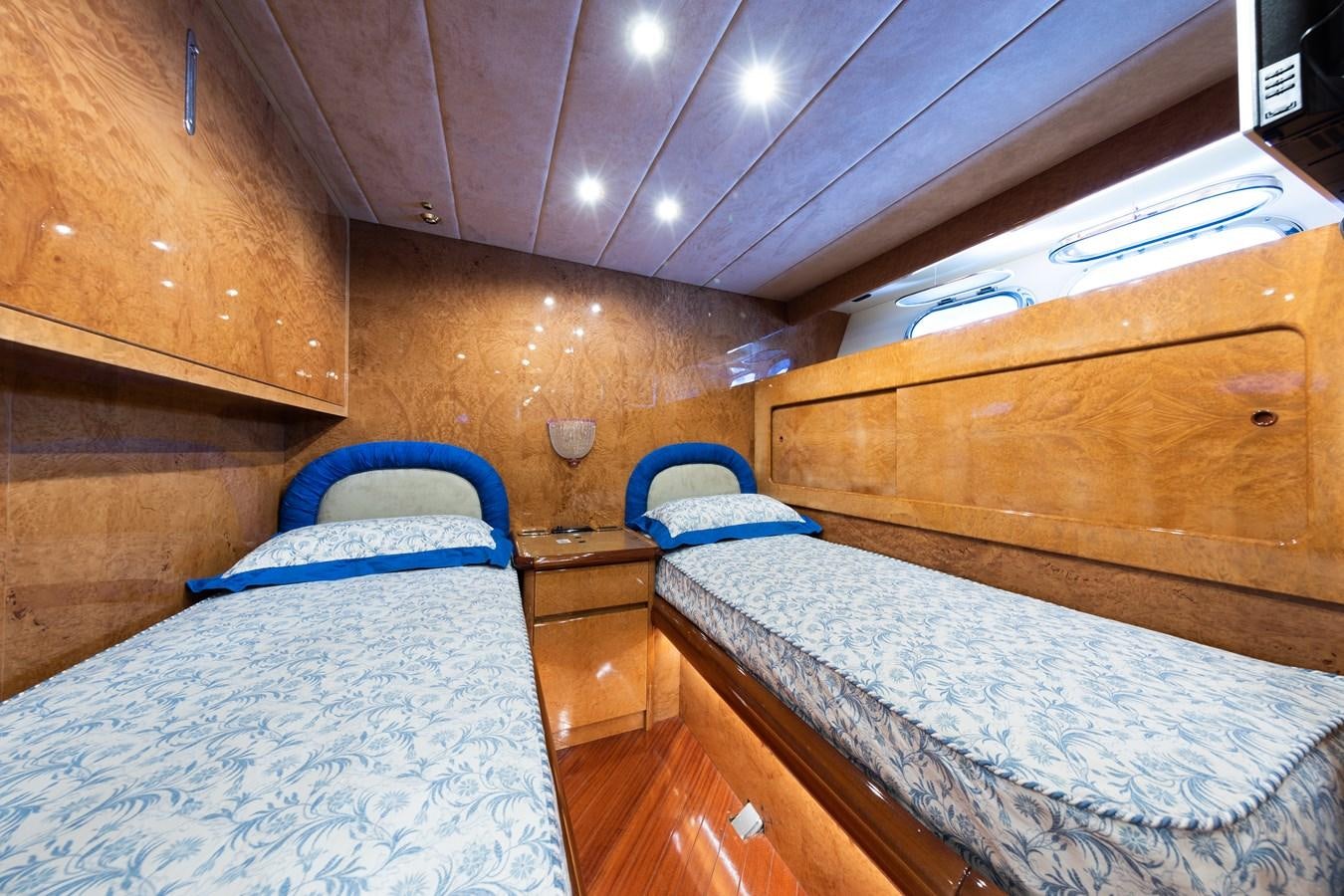 a couple of beds in a wooden cabin aboard BABY BOSS Yacht for Sale