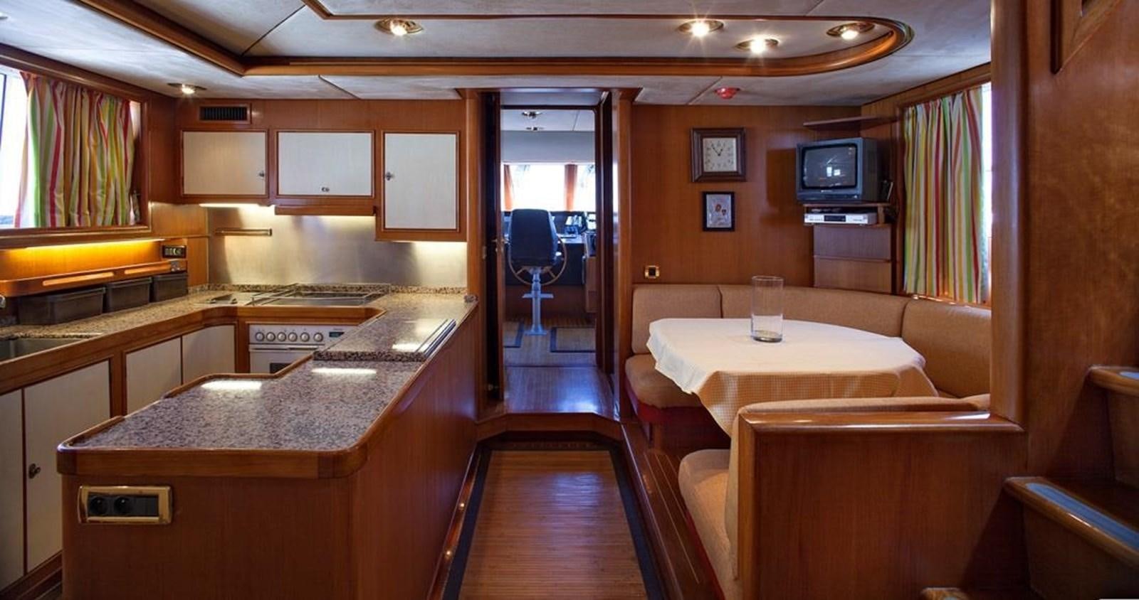 a large kitchen with a bar and a bar aboard ARMATHIA Yacht for Sale