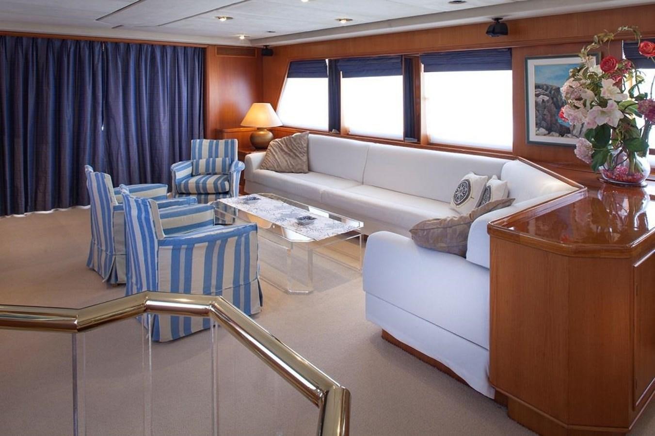 a living room with a couch and a table aboard ARMATHIA Yacht for Sale