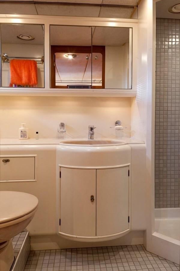 a bathroom with a sink and a mirror aboard ARMATHIA Yacht for Sale