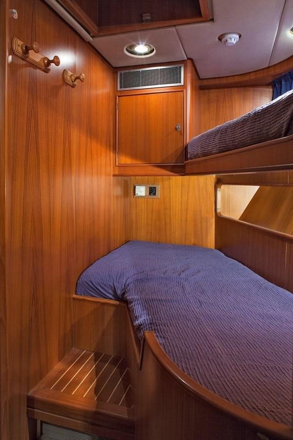 a bed in a room aboard ARMATHIA Yacht for Sale