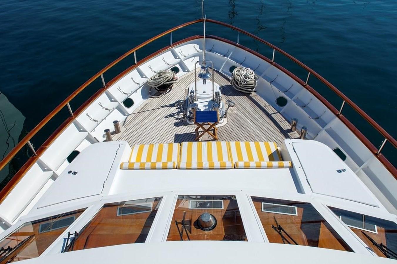 a large white boat with a group of people on it aboard ARMATHIA Yacht for Sale