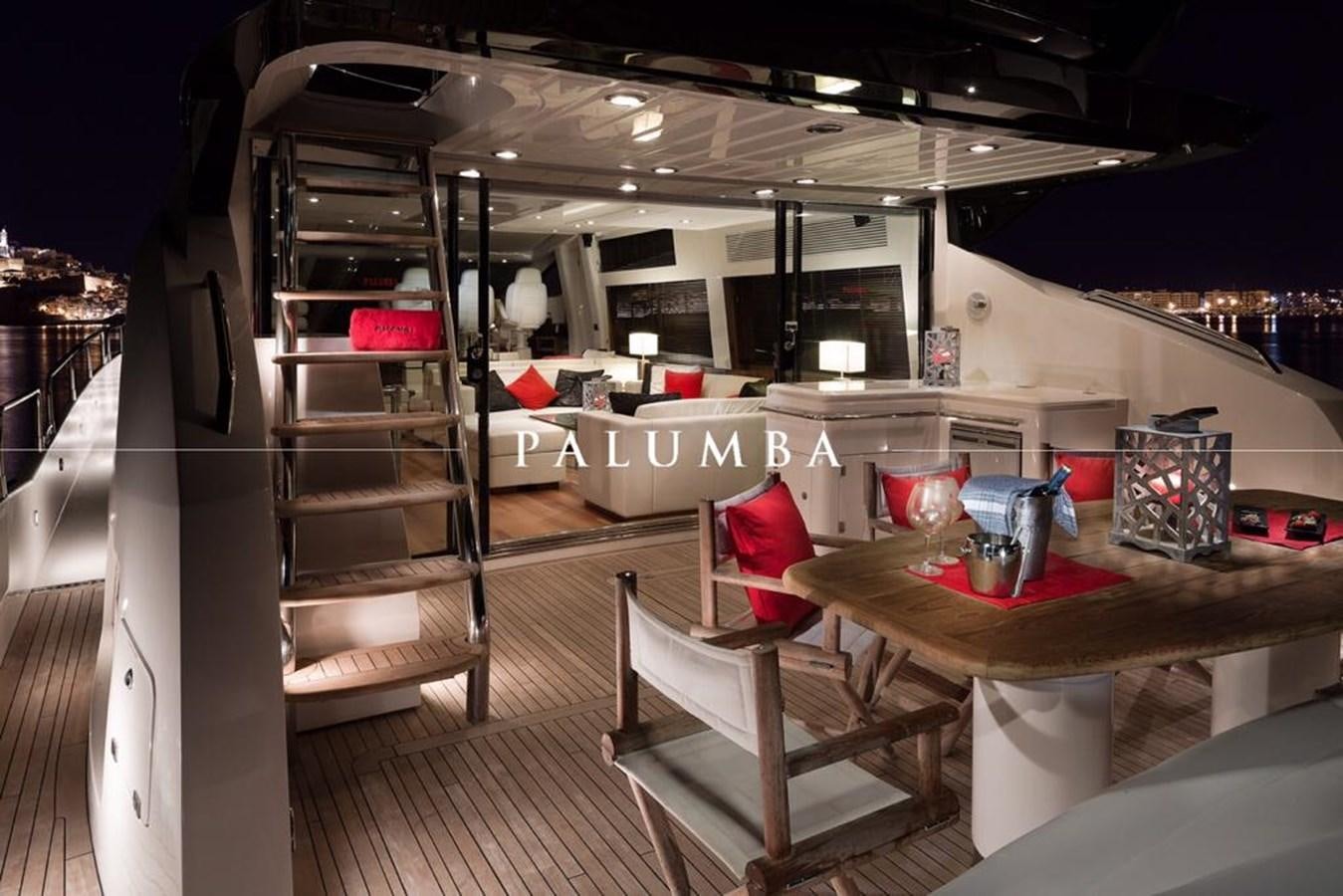 a room with a table and chairs aboard PALUMBA Yacht for Sale