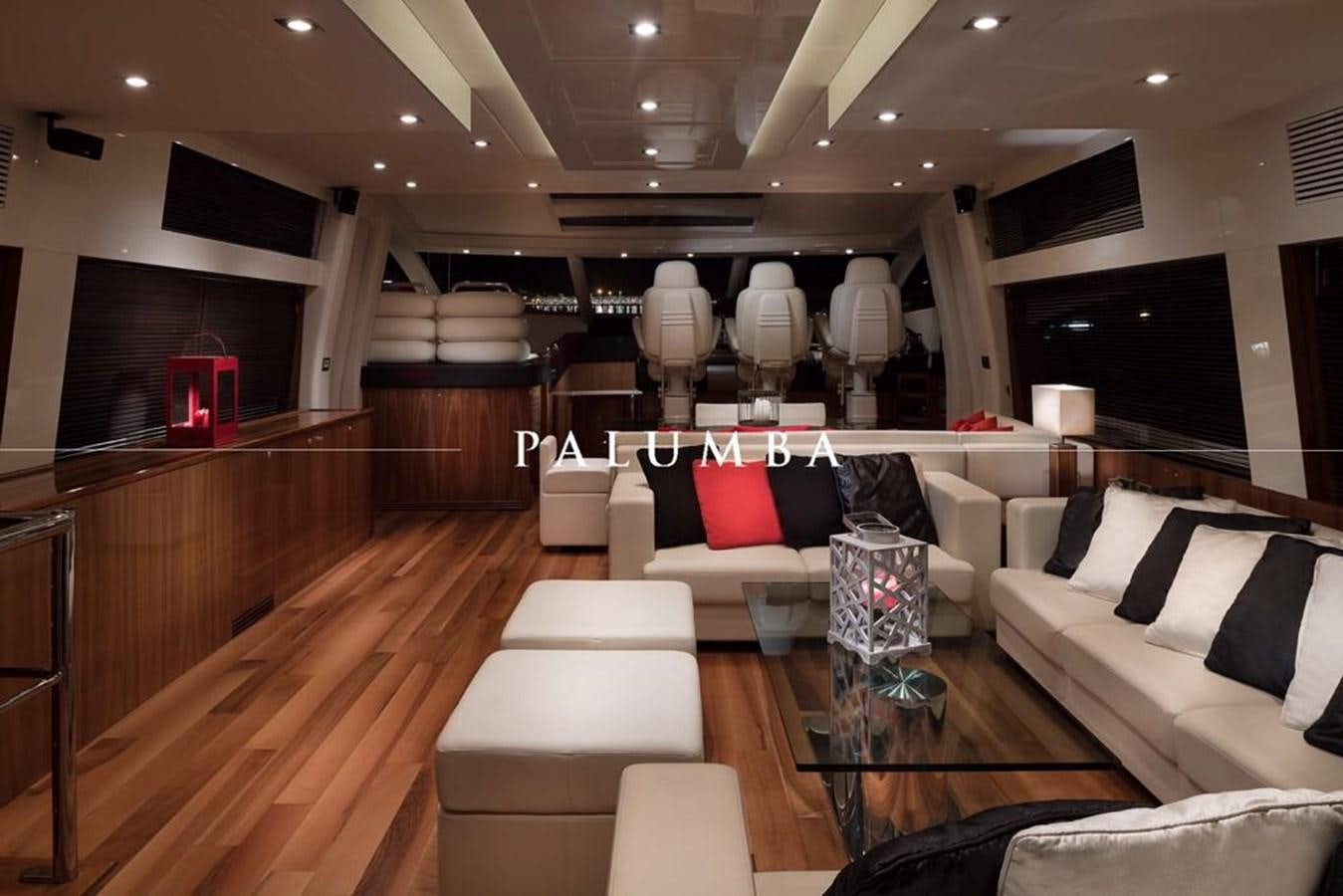 a room with a couch and a coffee table aboard PALUMBA Yacht for Sale
