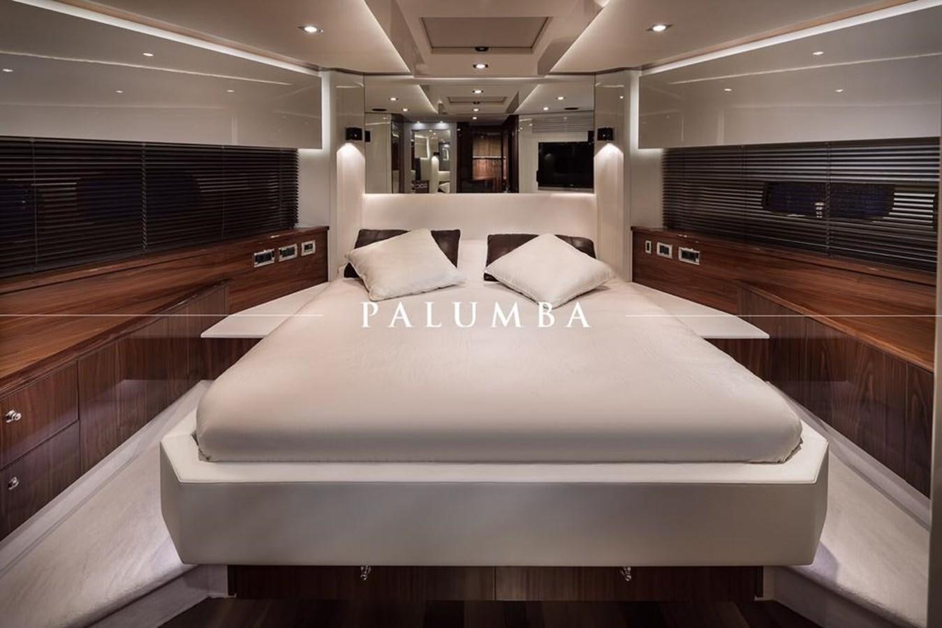 a large bed in a room aboard PALUMBA Yacht for Sale