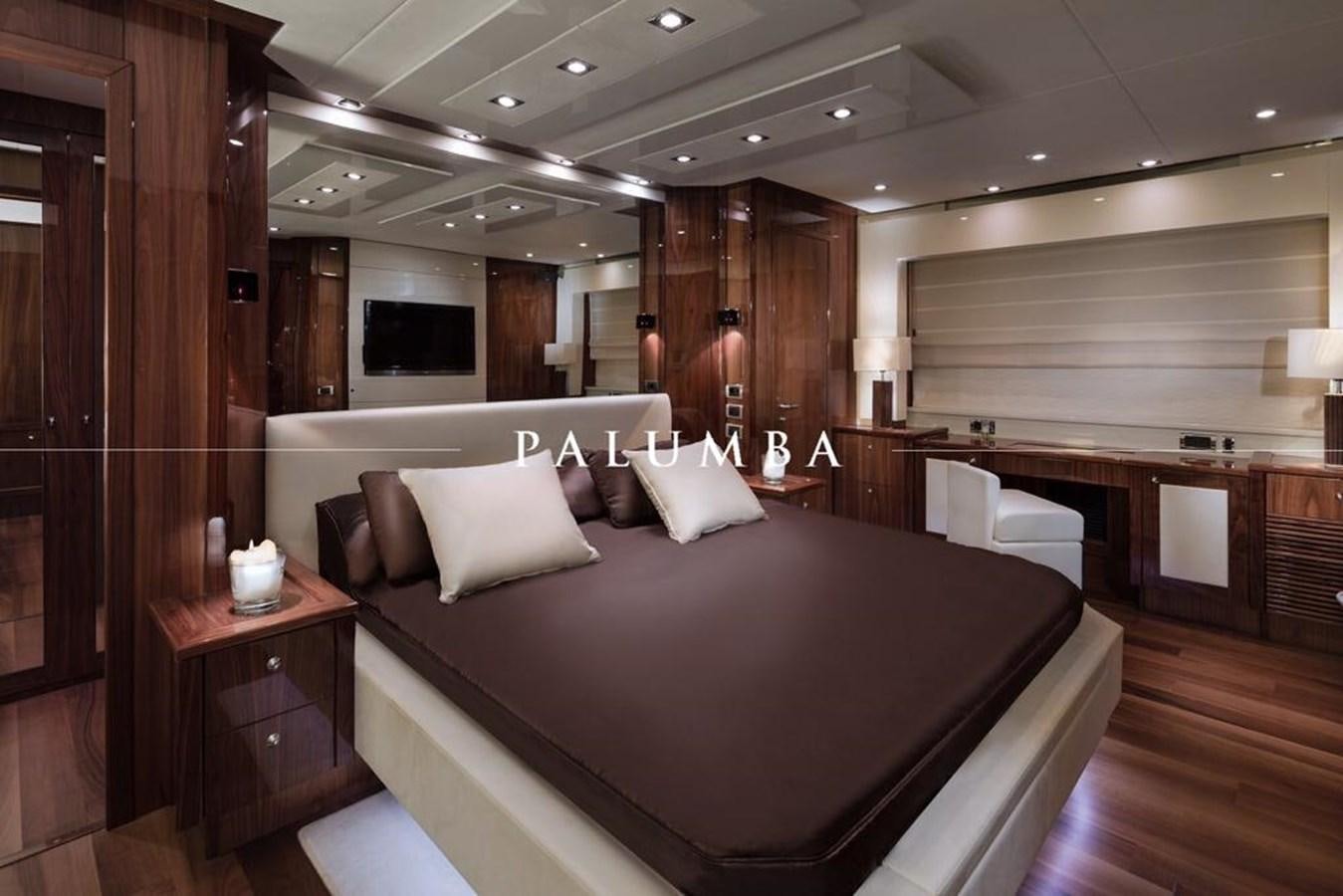 a room with a bed and a table aboard PALUMBA Yacht for Sale