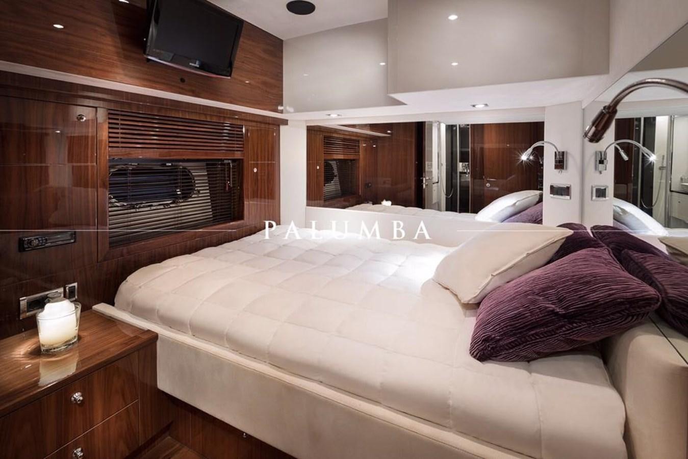 a bed in a room aboard PALUMBA Yacht for Sale