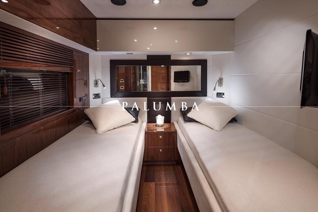 a room with a bed and a television aboard PALUMBA Yacht for Sale