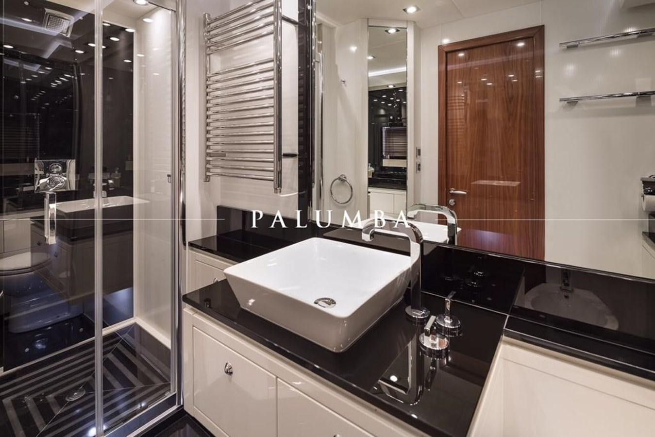 a bathroom with a large mirror aboard PALUMBA Yacht for Sale